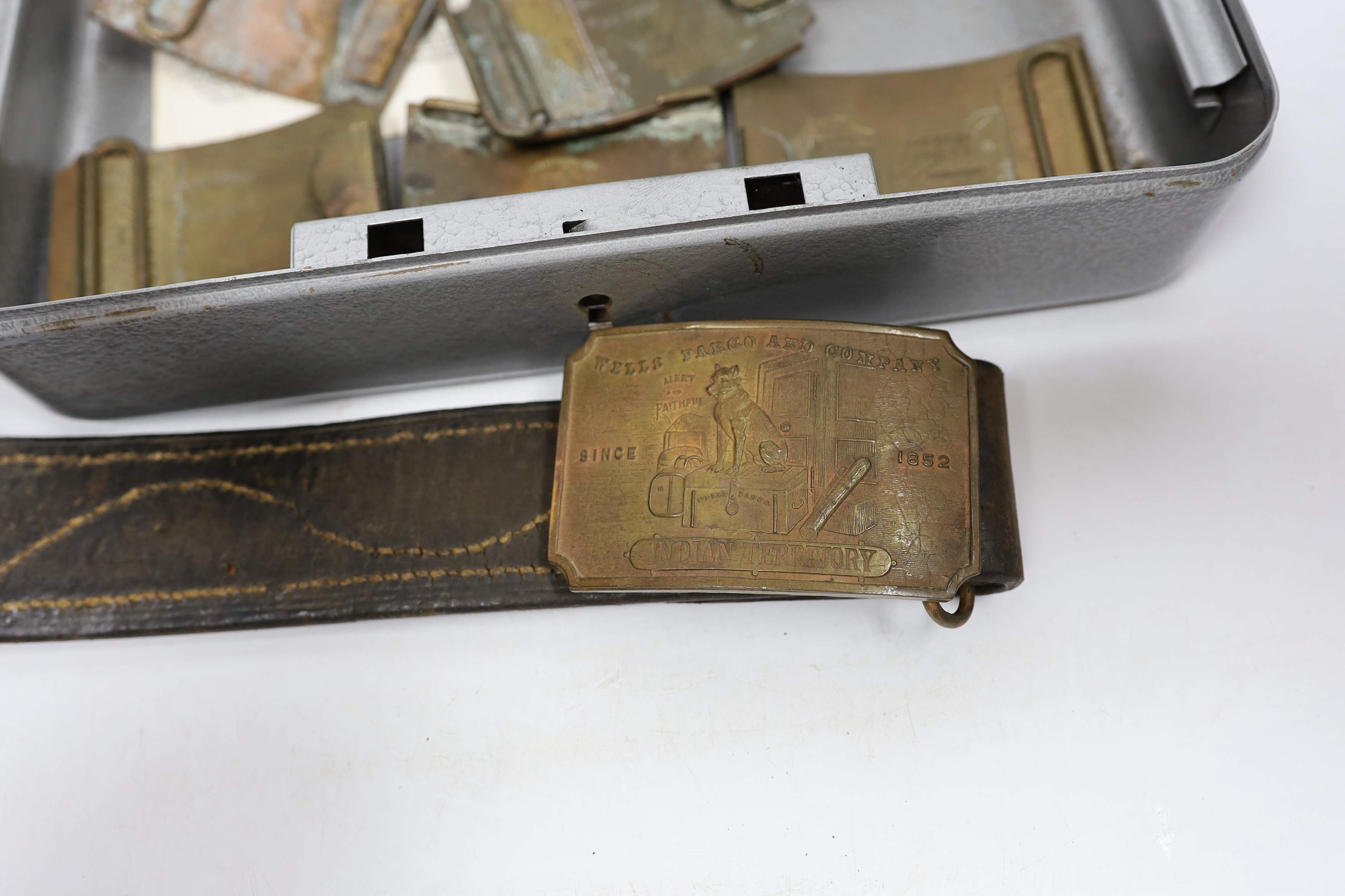 A collection of Wells Fargo and similar belt buckles by Tiffany & Co. Etc.